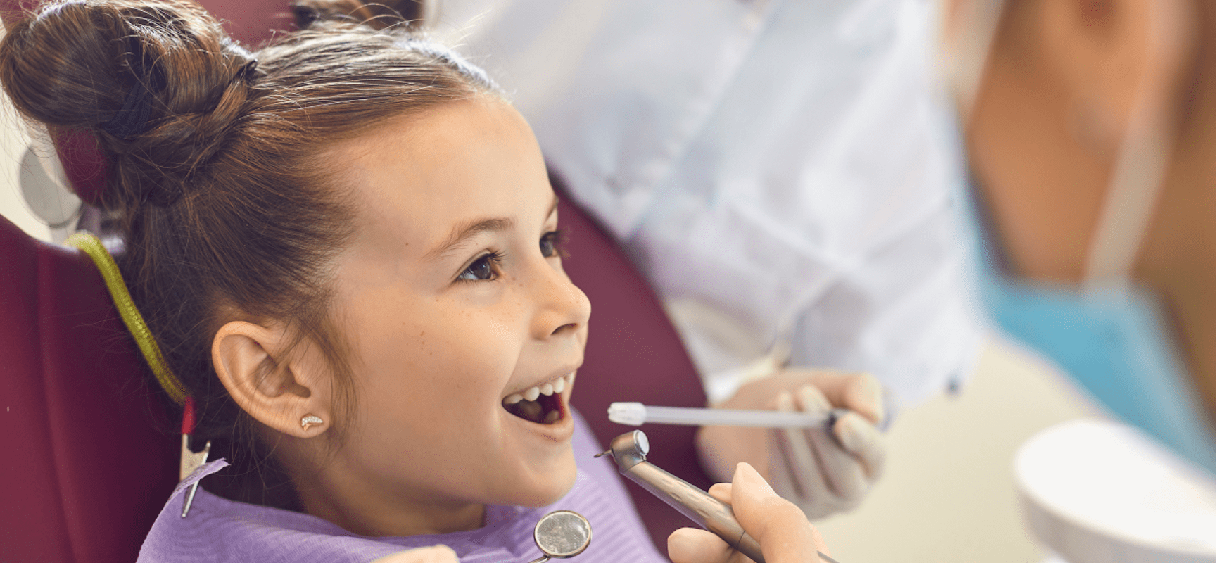 Child smiling at dentists office