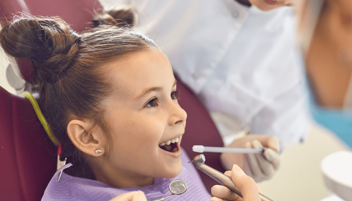 Child smiling at dentists office
