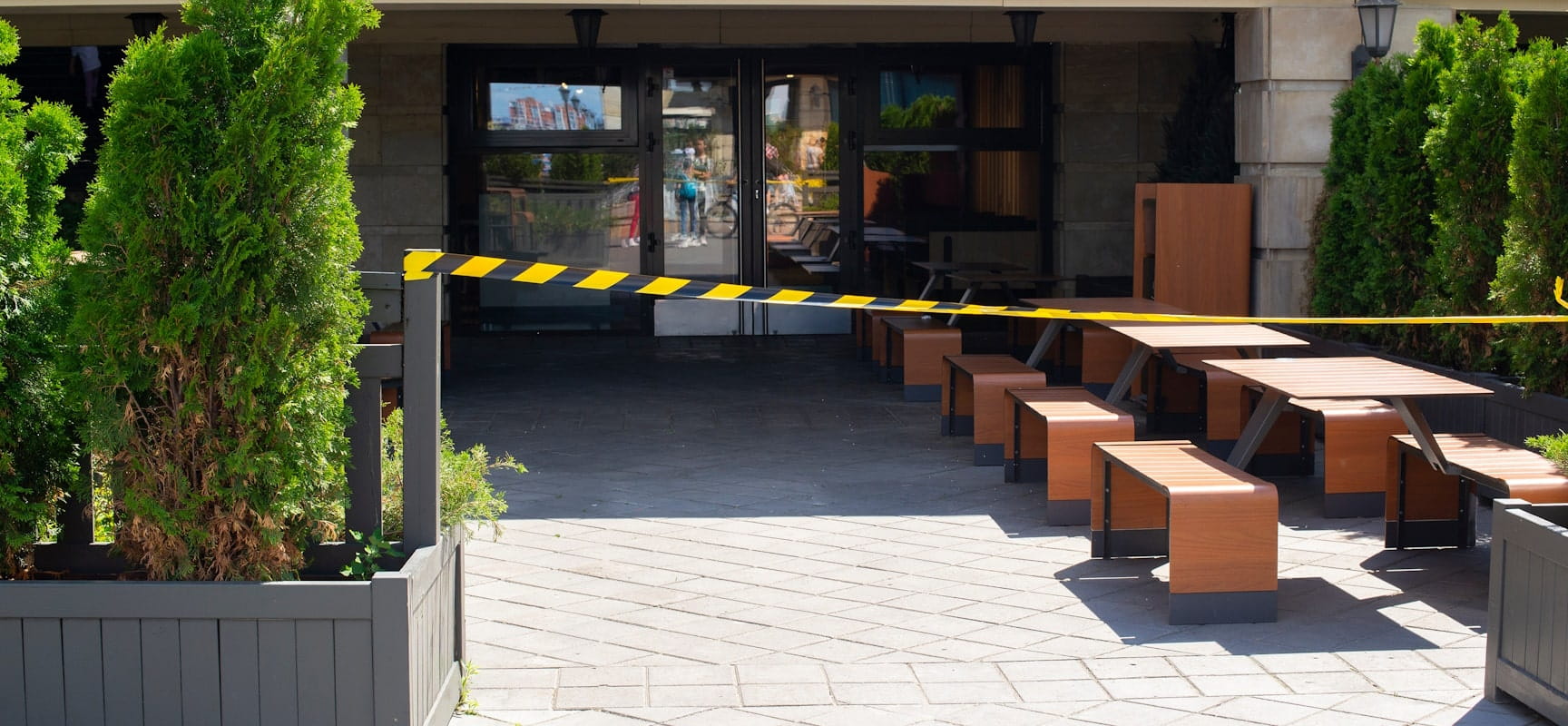 Outdoor seating surrounded by caution tape