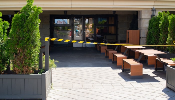 Outdoor seating surrounded by caution tape