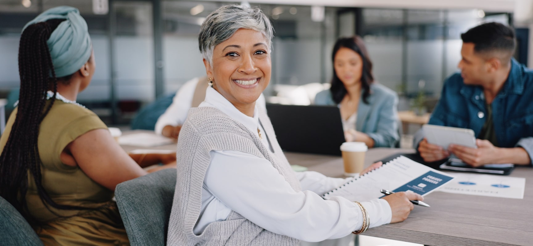 Woman turned around in chair and smiling