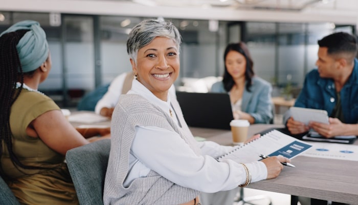 Woman turned around in chair and smiling